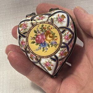 heart shaped trinket box with miniature perfume bottles
